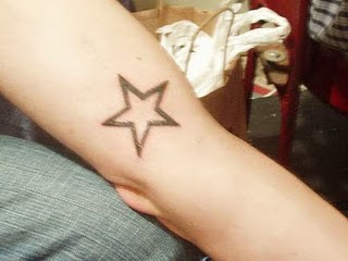 arm star tattoo