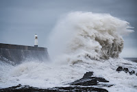 Lighthouse in storm - Photo by Marcus Woodbridge on Unsplash