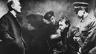 Mundt takes Alec Leamas into custody in The Spy Who Came in from the Cold, Directed by Martin Ritt