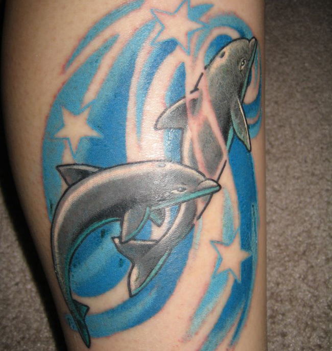 Dolphin tattoos are a highly versatile choice of design, 