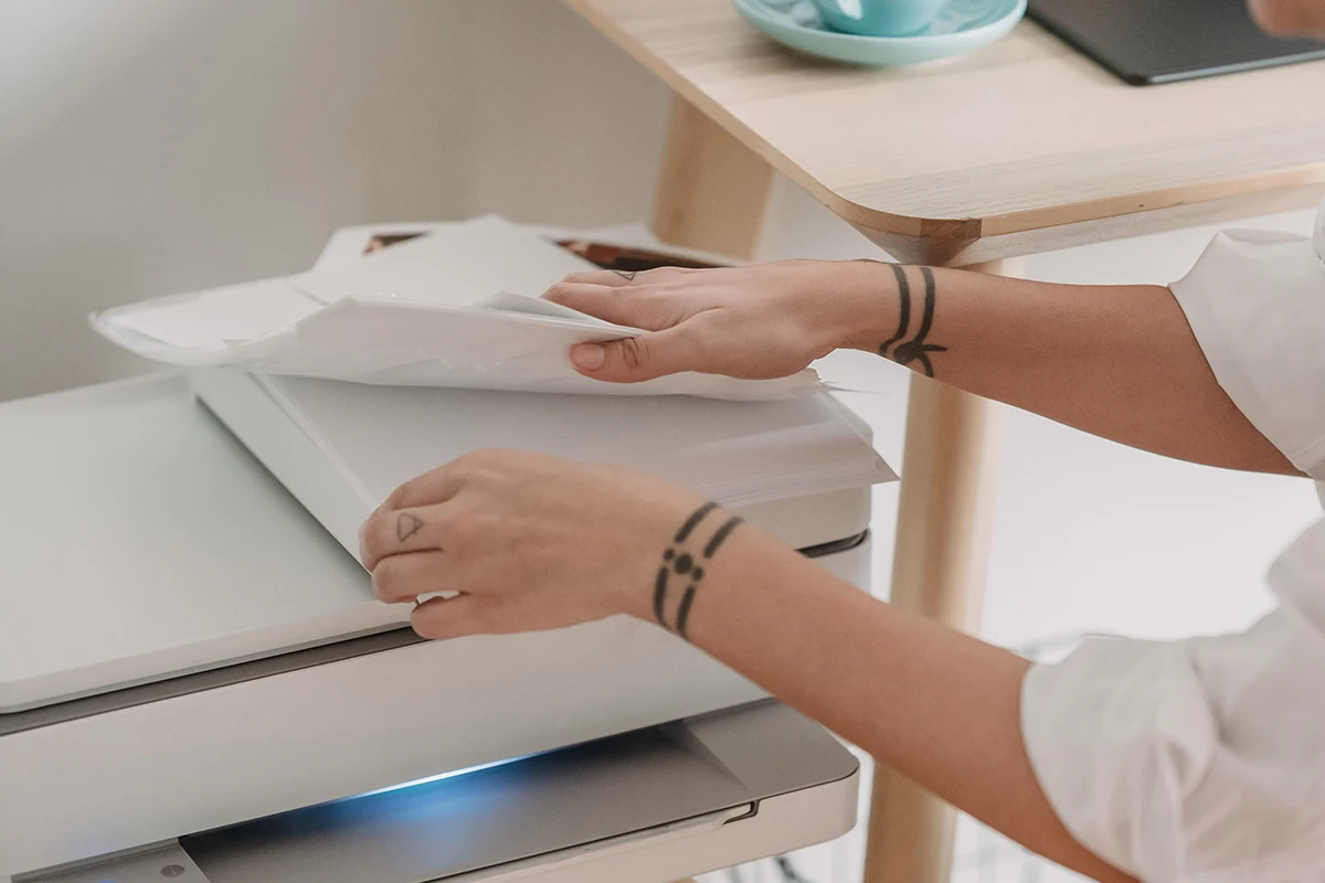 woman printing images at her home printer