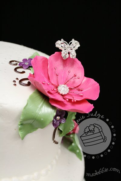 buttercream wedding cake gum paste flowers with rhinestones pink purple