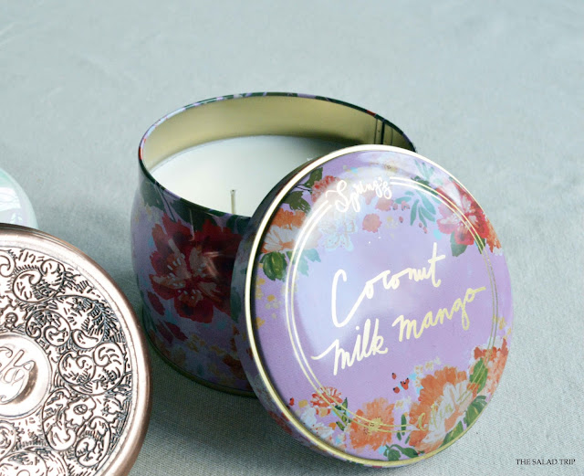 Beautiful floral tin candle holding the scent Coconut Milk Mango by Spring's Eden