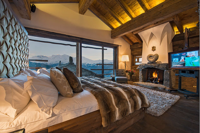 Picture of luxury gothic bedroom with fireplace and huge wooden bed