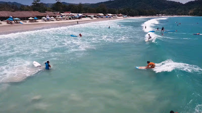 A royalty free of aerial drone shot beginner about surfer learn to surf on selong Belanak beach