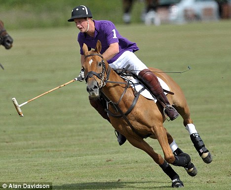 Giddy up: Prince Harry plays
