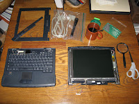 Display and base detached, display disassembled, and plug cut off from display.