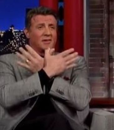 Sylvester Stallone performing the two-headed eagle