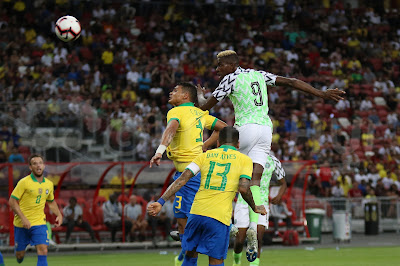 Nigeria's Victor Osimhen (9) got ahead of Thiago Silva (3) in this aerial duel