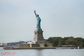 The famous Statue of Liberty as seen from the passing Staten Island Ferry.  Travel photography by Kent Johnson.