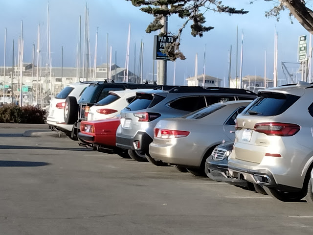 Ferrari 412i peeking out of a sea of SUVs