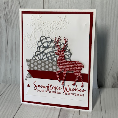 Christmas card with snowflakes, banners and a deer