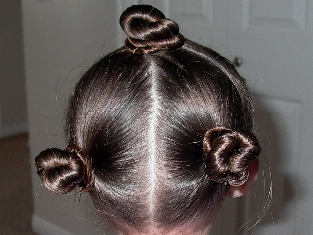 Little Girl's Hairstyles - How to do a twist bun with pull thru ponys  title=