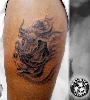  necklaces, and eyebrow piercings are a part of bull tattoo art.