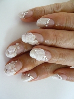 White or pink nails with beautiful flower patterns are always the best 