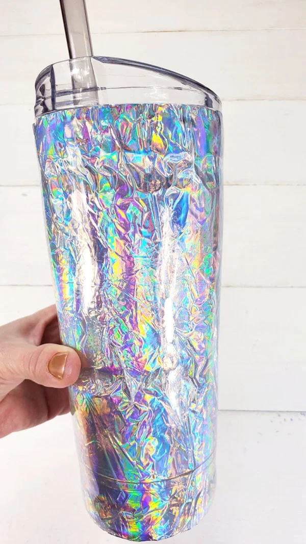 Make a resin tumbler that rivals the shimmer of a mermaid tail! This iridescent resin tumbler diy is easy to make and has texture, shine and smoothness.