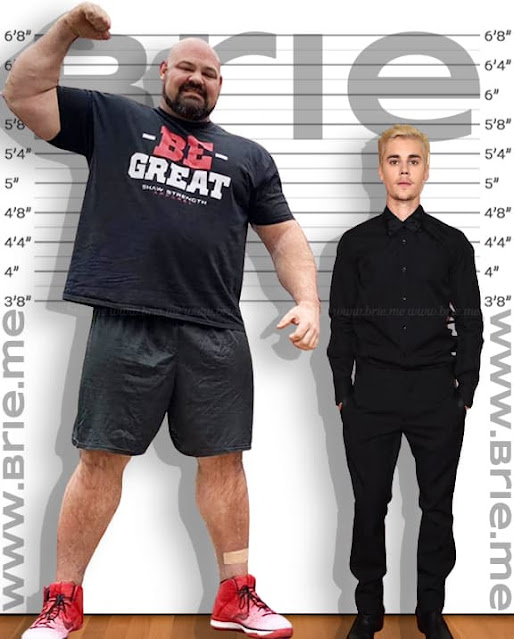 Brian Shaw standing with Justin Bieber