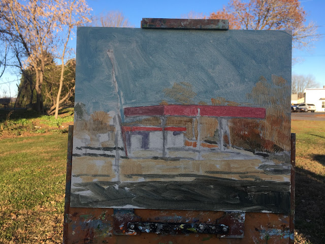 Oil painting of abandoned gas station with brown trees in background and asphalt road in foreground.