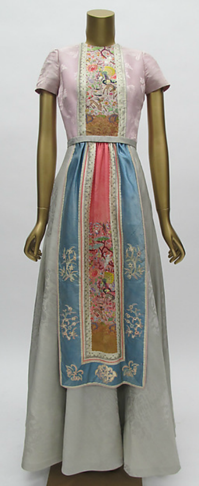 Long multi-colored dress with Asian look by Mainbocher displayed on dress form