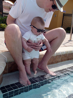 Freddie with Daddy by the pool