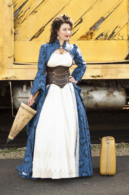 women's steampunk costumes. blue jacquard bolero coat with white dress and brown leather corset for a colorful steampunk bride