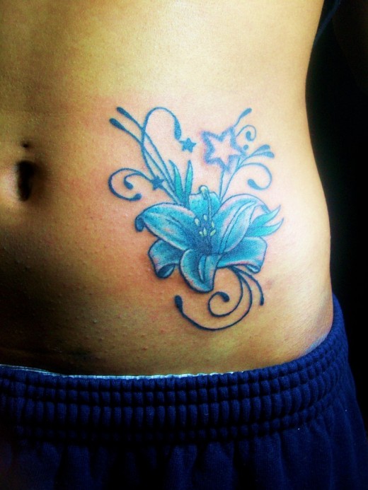 tattoos for girls on side of stomach. Beautiful Girl With Flower Stomach Tattoos
