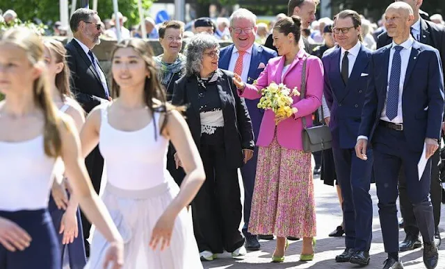 Crown Princess Victoria wore a tailored buttoned fuchsia blazer by Zara, and a pink plisse pleated midi skirt by & Other Stories