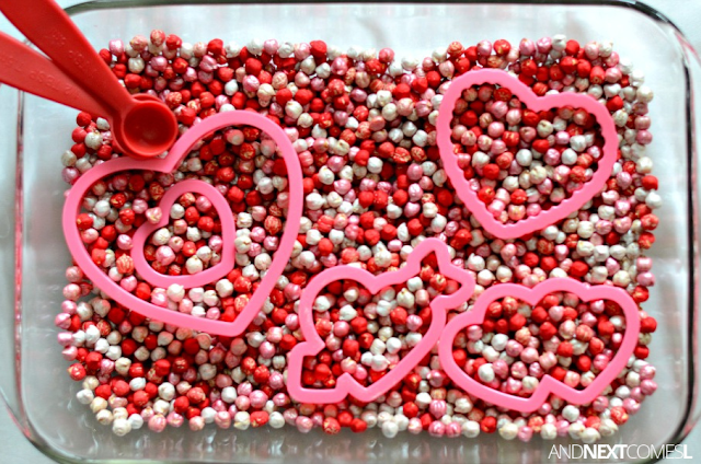 Valentine's Day sensory bin for kids with dyed chickpeas