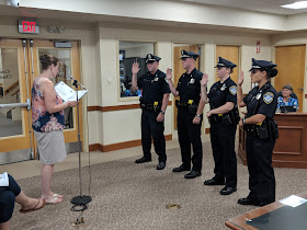 Officers Connor Crosman, Tyler Peabody, Andressa Rosa and Amanda Ayer getting sworn in by Town Clerk Teresa Burr