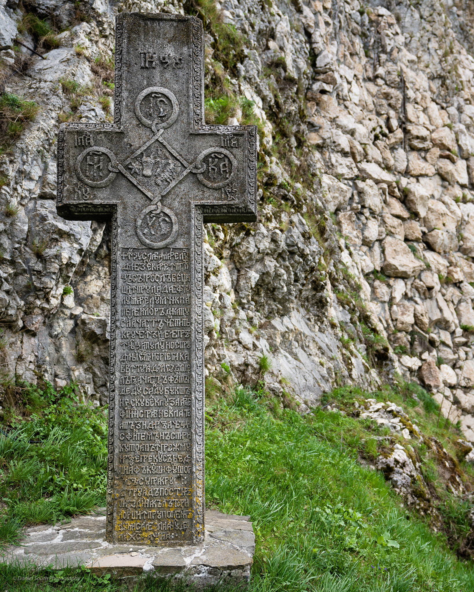 a photo of an engraved cross at bran castle romania