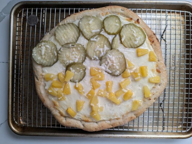 DiGiorno Pineapple Pickle Pizza top-down view after baking.
