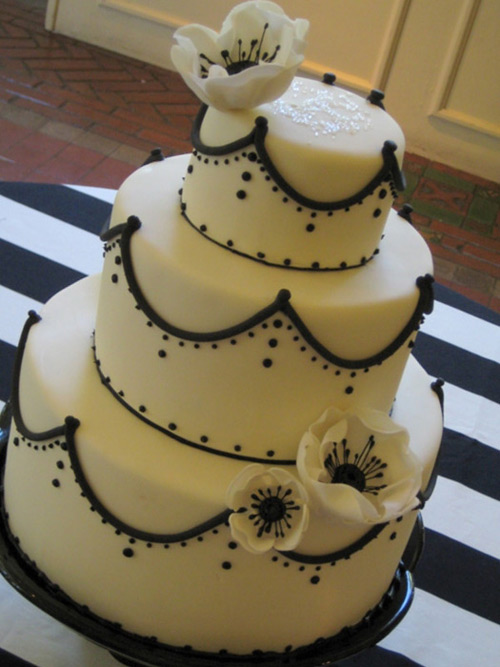 Stunning three tier black and white wedding cake with anemones from Not Just