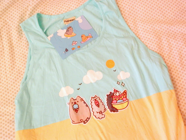 A vest top/tank top featuring Pusheen the cat characters at the beach 