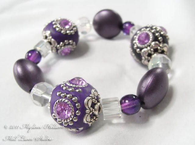 Simple design, stunning beads! Purple Kashmiri bead stretch bracelet