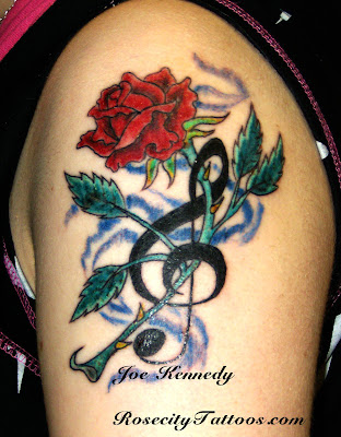 Music and flowers make for a great tattoo design