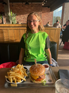 Me wearing the neon green finishers shirt with the burgers and fries I had for dinner.