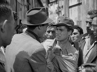 the flustered father gets involved in a brawl while searching for his cycle, bicycle thieves, directed by vittorio de sica