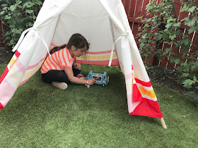 hpe child teepee set up in the garden on grass 