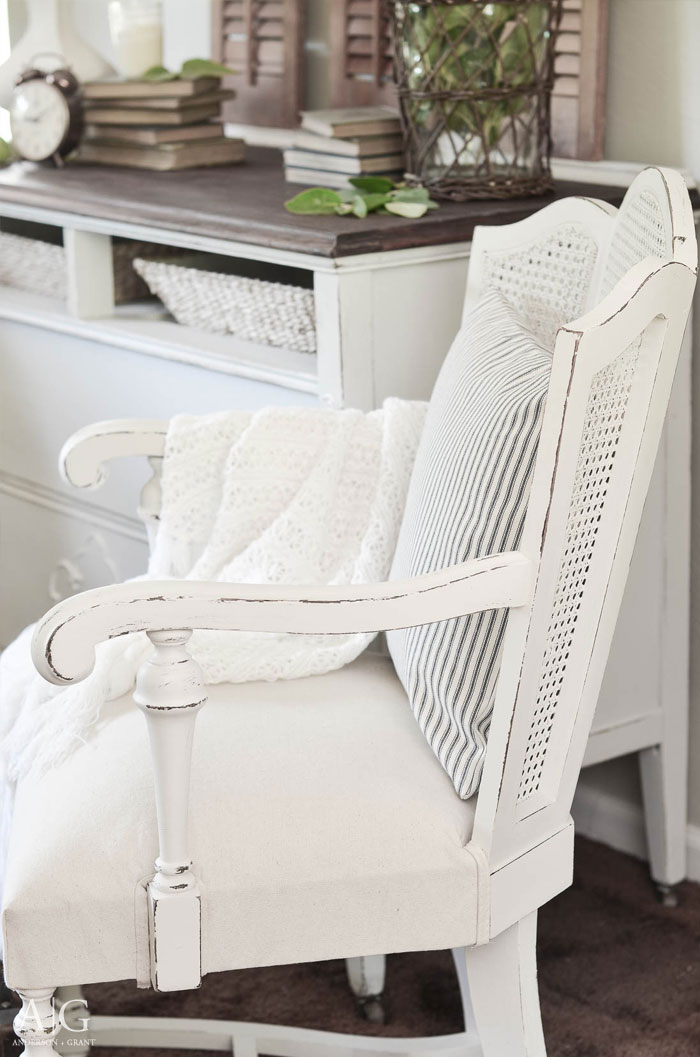 A pair of vintage cane backed chairs found at a garage sale are given a stunning farmhouse style makeover with Fusion Mineral Paint and a simple drop cloth.  |  www.andersonandgrant.com