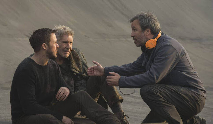 Denis Villeneuve with Ryan Gosling and Harrison Ford in Blade Runner 2049 set