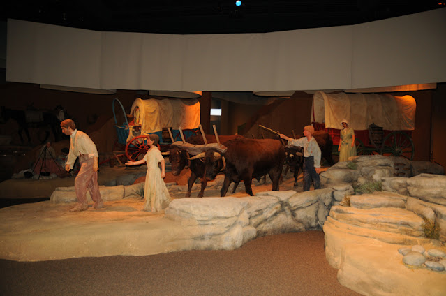 pioneers walking by wagon, Historic Trails Museum