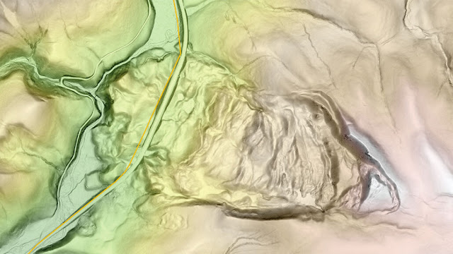 This laser-derived map of a region in Montana near Yellowstone National Park near US Highway 191 (adjacent to the yellow line) reveals evidence of a large landslide in the past. High elevations are brown and white, while low elevations are green. USGS