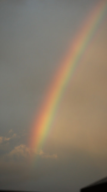 Storm Louis: regenboog en wolken