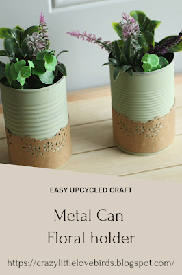 Pinterest pin Two metal cans painted light green displaying flowers and decorative paper