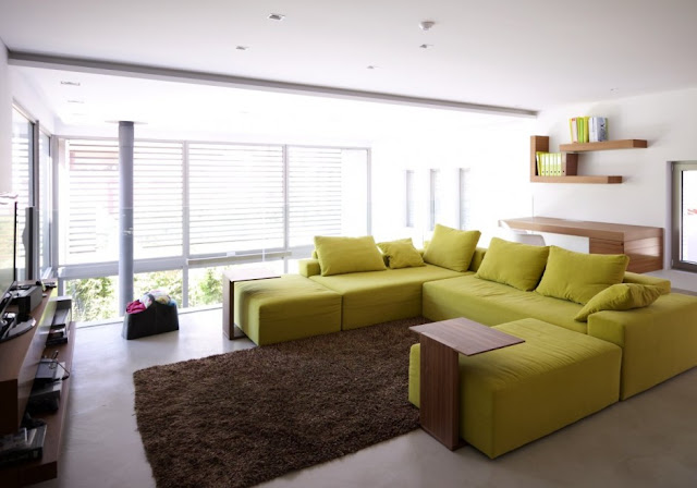 Green sofa in the second living room 