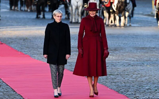 Queen Mathilde wore a wine red burgundy coat and wine red burgundy dress by Naatan. First Lady Paola Rodoni Cassis