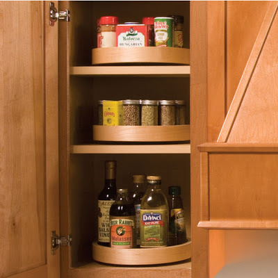 lazy Susans for spices, inside a cabinet