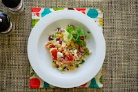 A bowl of Greek couscous salad