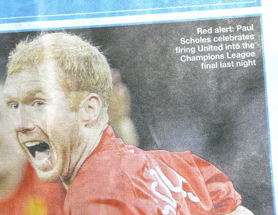 Red alert: Paul Scholes celebrates firing United into the Champions League final last night