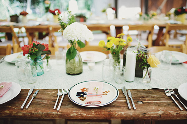 Mismatched vintage place settings and mason jar centerpieces